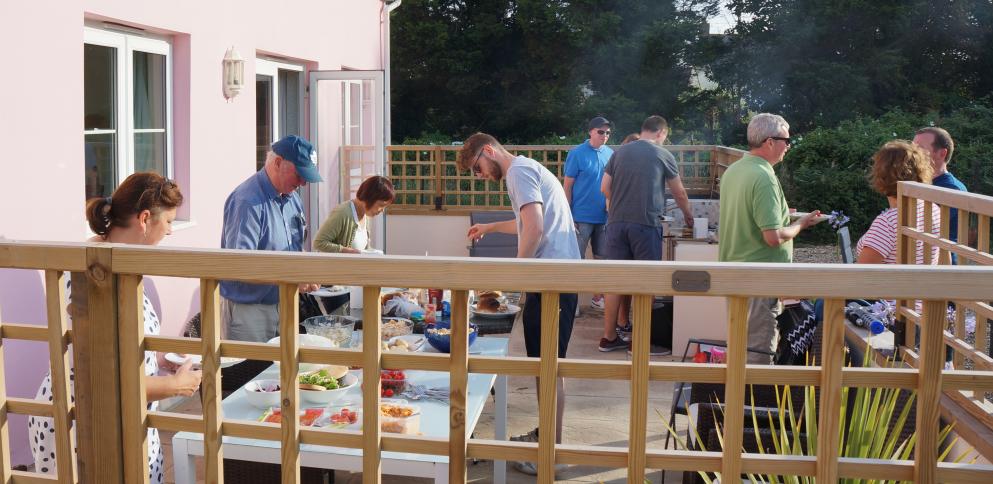 Holiday guests enjoying a BBQ on the terrace