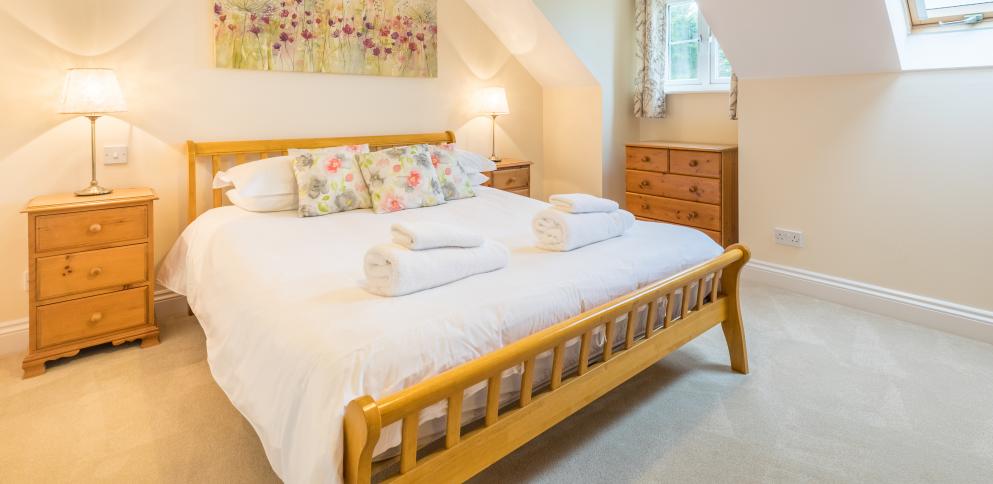 master bedroom in three bedroom apartment at The Ellingham Cottages