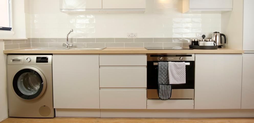 kitchen with silver washing machine