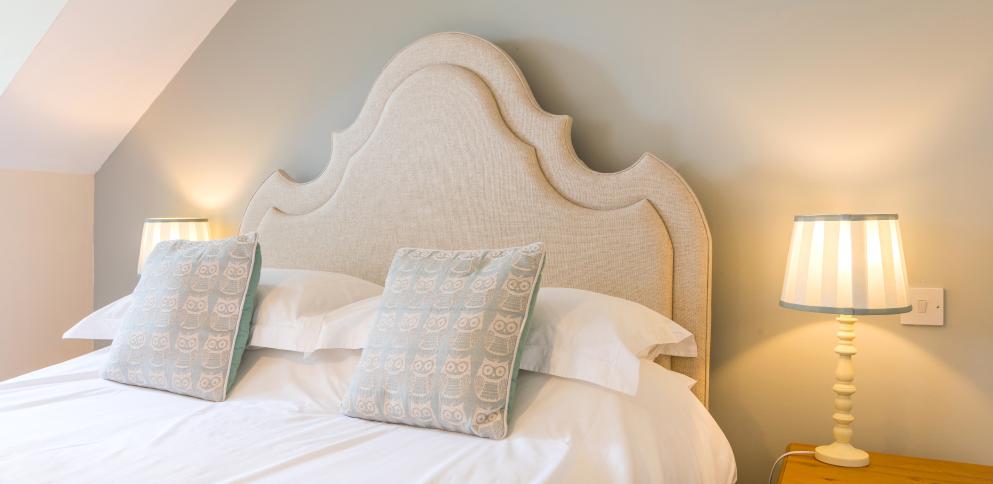 bed with cream headboard