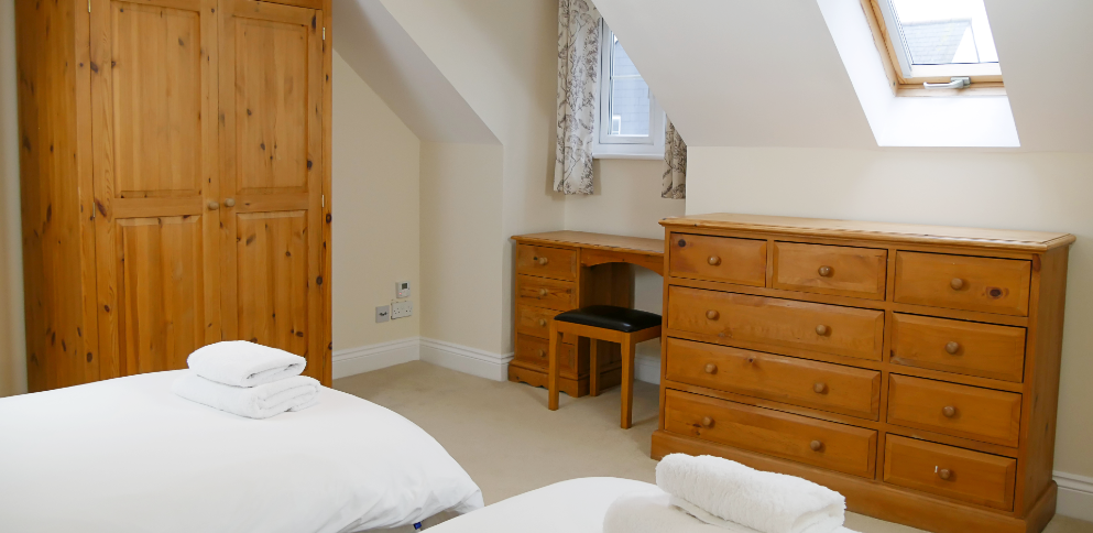twin bedroom at front of 3 bed apartment at The Ellingham Cottages