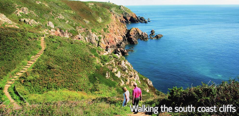 Couple walking the south coast cliffs of Guernsey