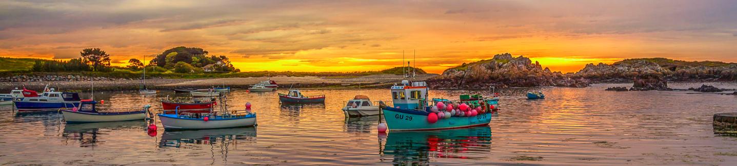 Fishing boats in Bordeaux Harbour showing Guernsey culture.