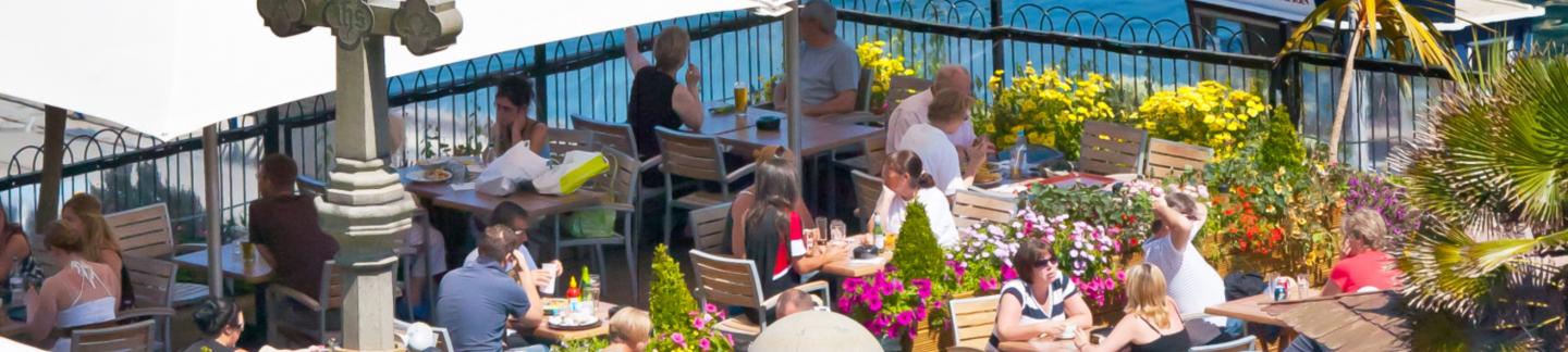 al fresco dining at a roof-top terrace restaurant in Guernsey