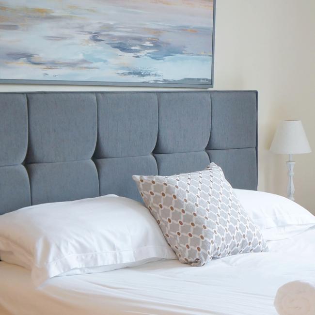 bed with grey headboard