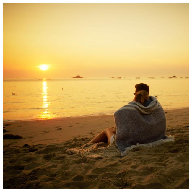 Couple watching the sun go down at Cobo