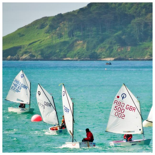 Children sailing in Havelet Bay